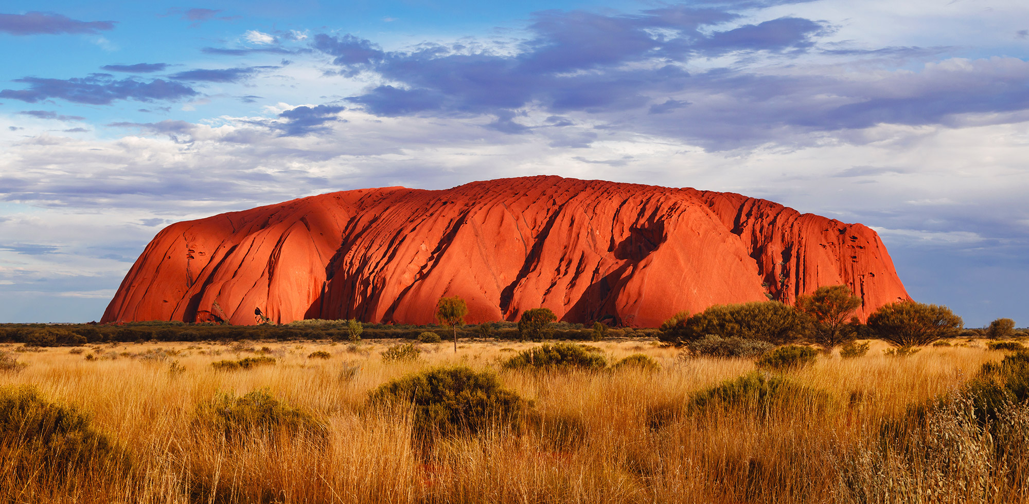 Besøg det hellige Uluru (Ayers Rock) på din rundrejse i Australiens outback.