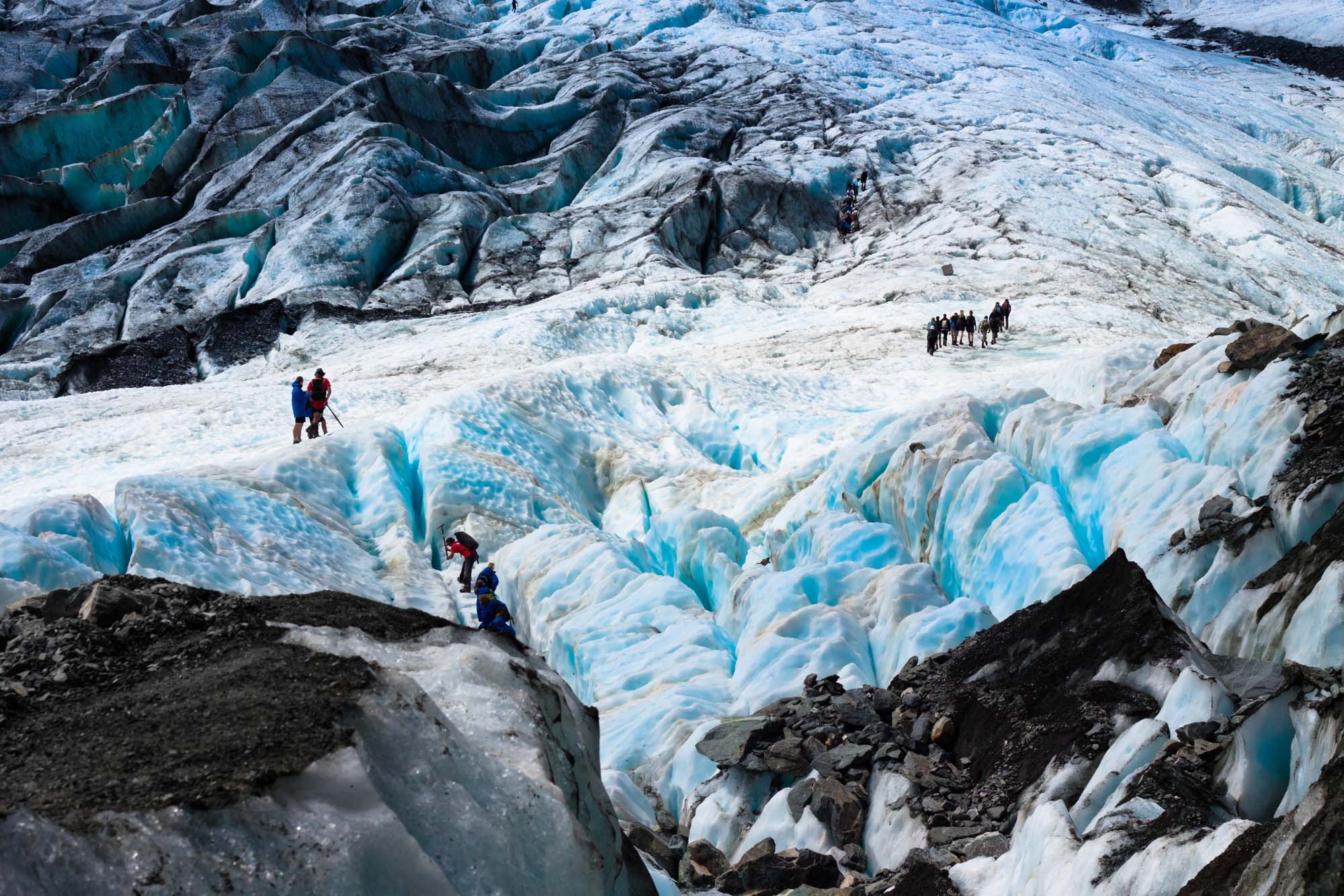 New-Zealand-franz-joseph-glacier-people-hiking-shutterstock_90518197